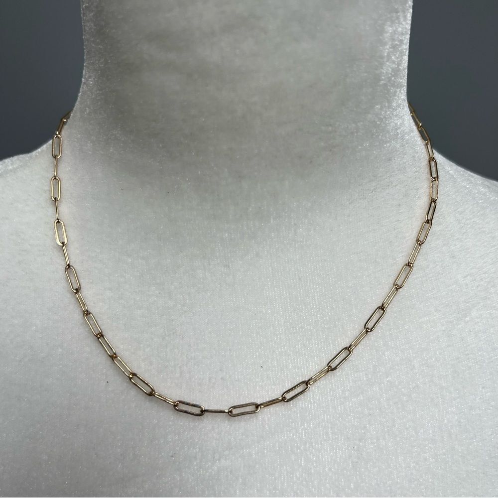 Gold tone chain link necklace with star pendant on back